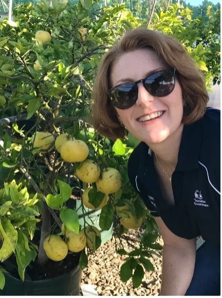 Veronica Hayes with a citrus plant